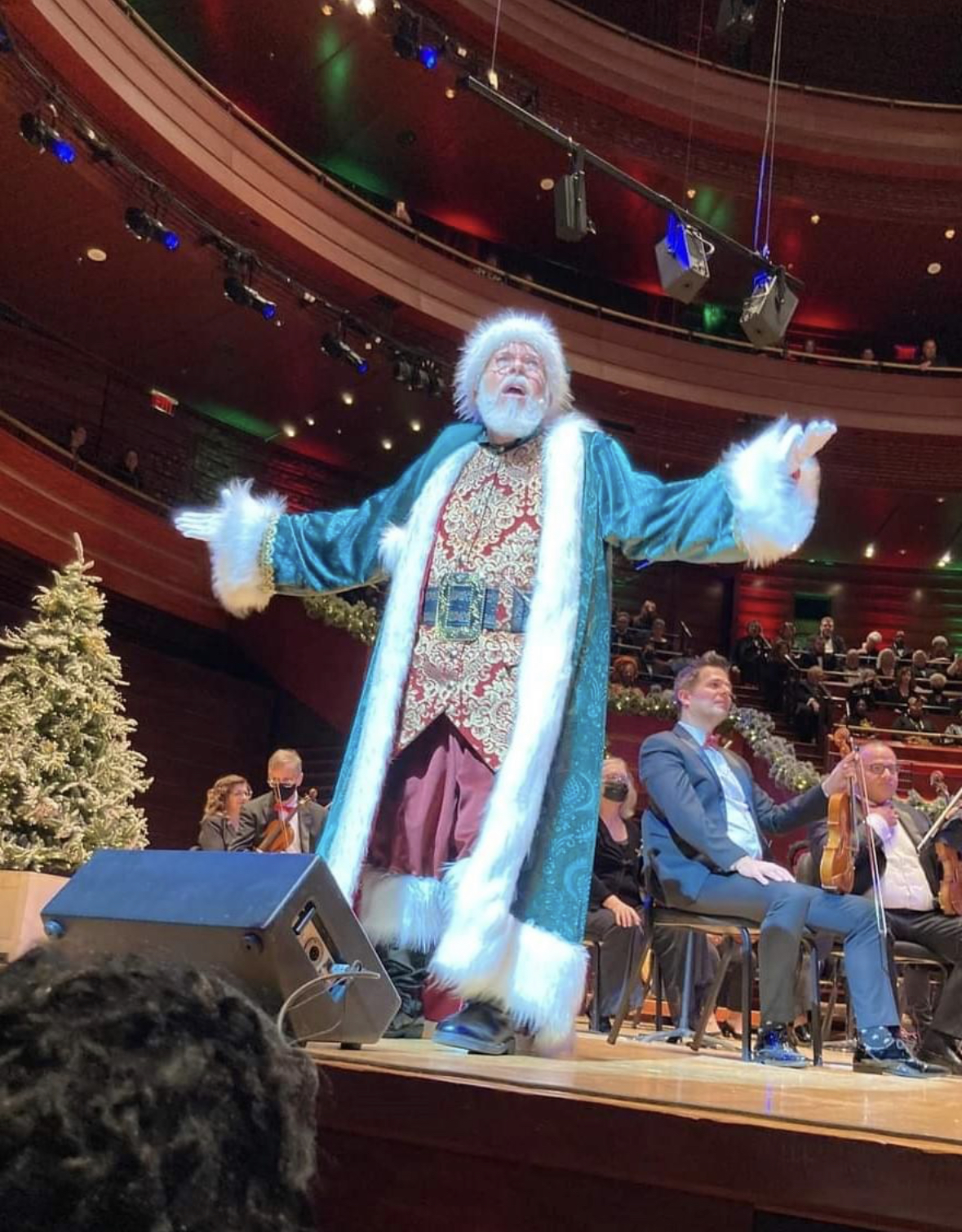 CJ Kringle smiling with a child